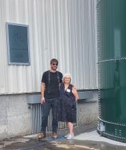 Eben Bayer and Alice Swersey stand together at the dedication of the Swersey Silos.